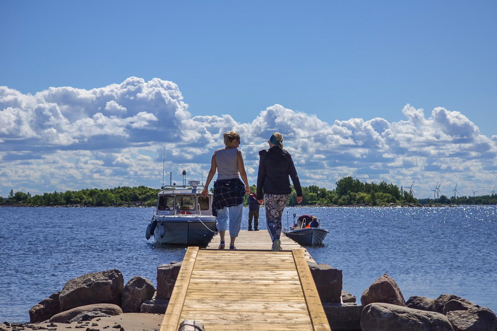 tasku island pier boat and ladies